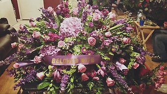 Casket Funeral Flower Arrangement in Purple Mix Flowers