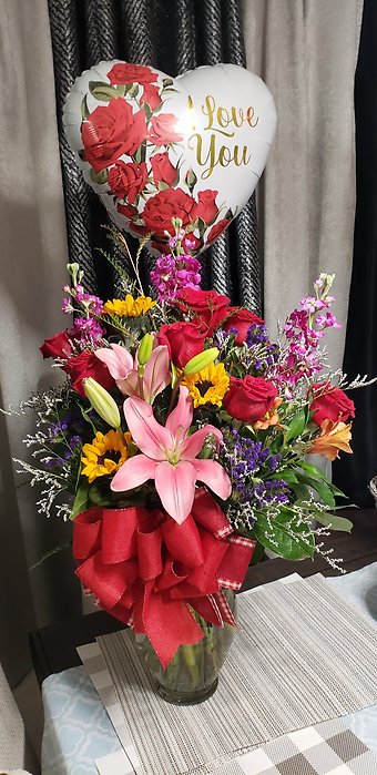 A Perfect Red Dozen with mix spring flowers